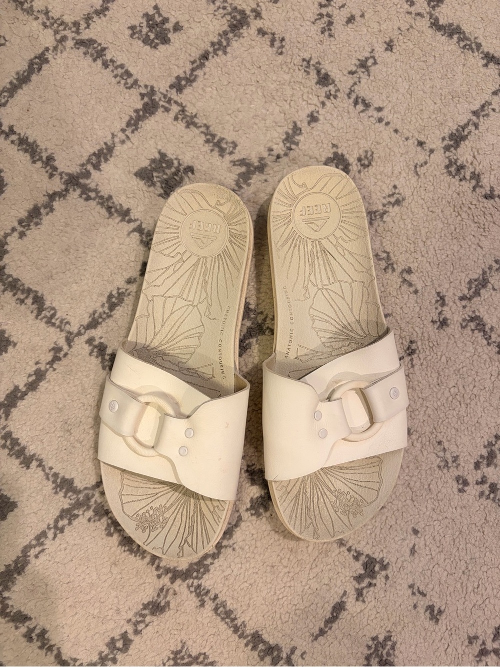 Reef women’s Off-White Slide Sandals with Buckle Accent
